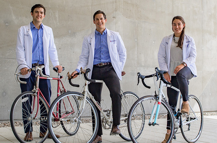 Medical Students Outside of HSEB with Their Bikes