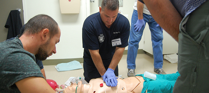 A Medic Performing CPR on a Mannequin