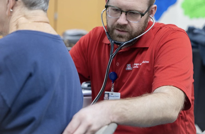 Dexter Guddlebrook — a medical student in the Rural Health Program, who helps to run the Health Clinic at the Payson Warming Center — has a passion for improving rural health care