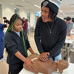 Students practicing CPR techniques