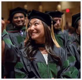 A Medical Student Smiles in Her Cap and Gown at Commencement 