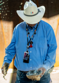 Miguel Flores, Jr., a Native American traditional healer and spiritual leader, prepares for the blessing ceremony