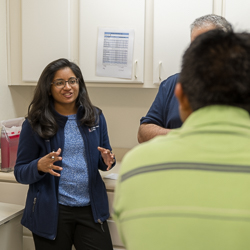 A Student Working with a Patient at the Wesley Community and Health Center