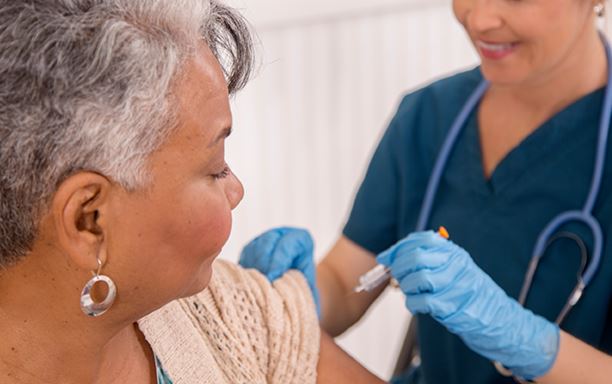 Nurse Administering the Flu Shot to a Patient