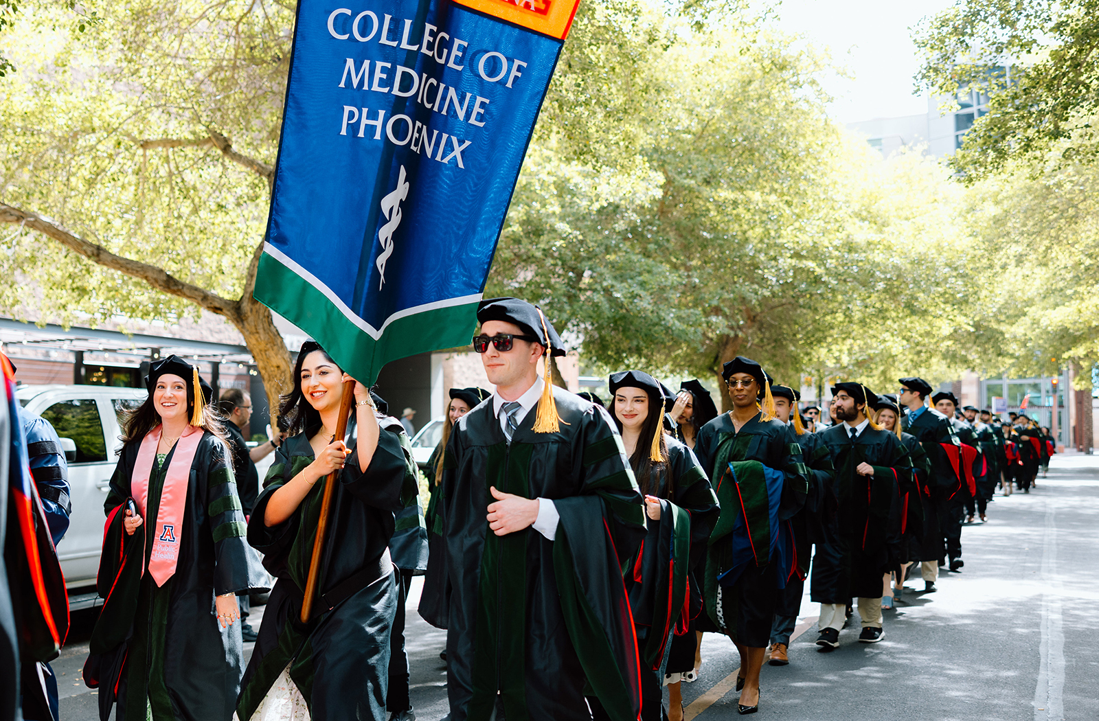 Led by a bagpipe and drum corps, the Class of 2025 processed through downtown Phoenix into their Convocation ceremony. Led by a bagpipe and drum corps, the Class of 2025 processed through downtown Phoenix into their Convocation ceremony.