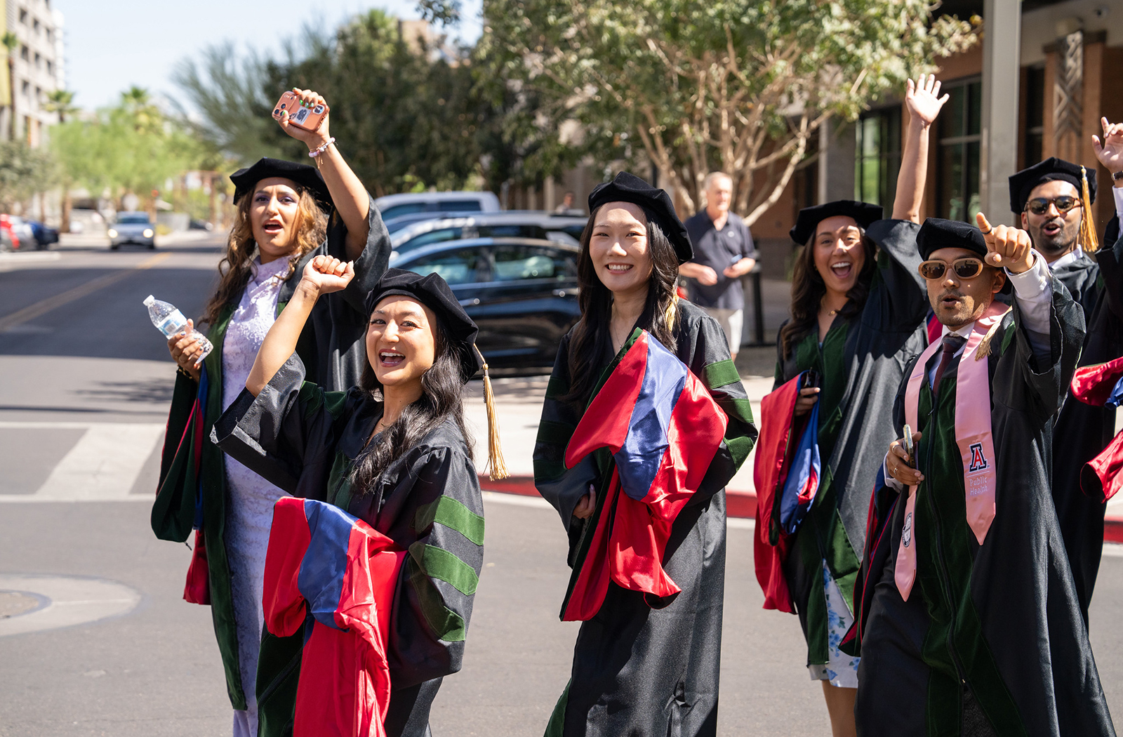 Members of the Class of 2026 process through the streets of Downtown Phoenix to the Orpheum Theatre.