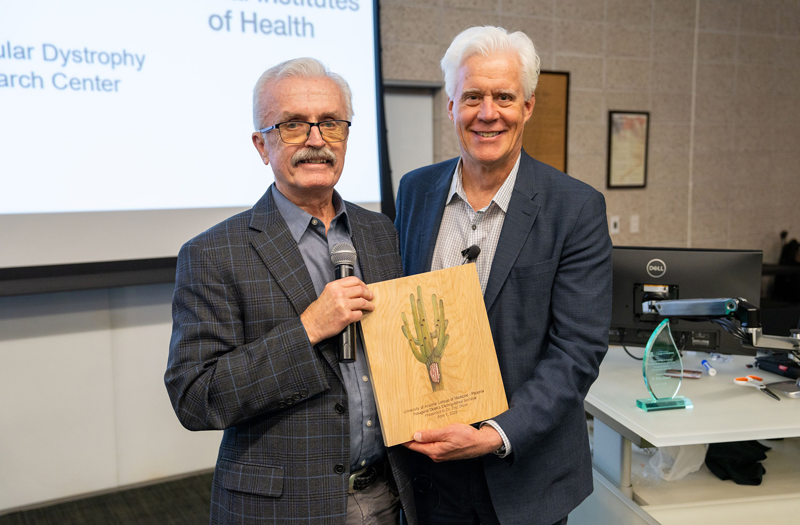 Eric Olson, PhD, with Chris Glembotski, PhD, at his Dean's Distinguished Seminar presentation.