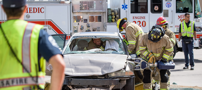 Firefighters Work the 'Jaws of Life' on a Damaged Motor Vehicle
