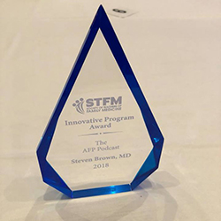 glass innovation award trophy from the Society of Teachers of Family Medicine