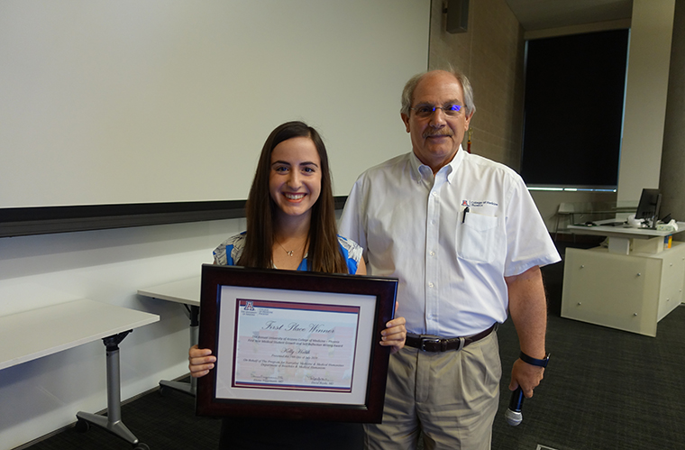 Medical Student Kelly Habib Holds Her Award with Dr. David Beyda