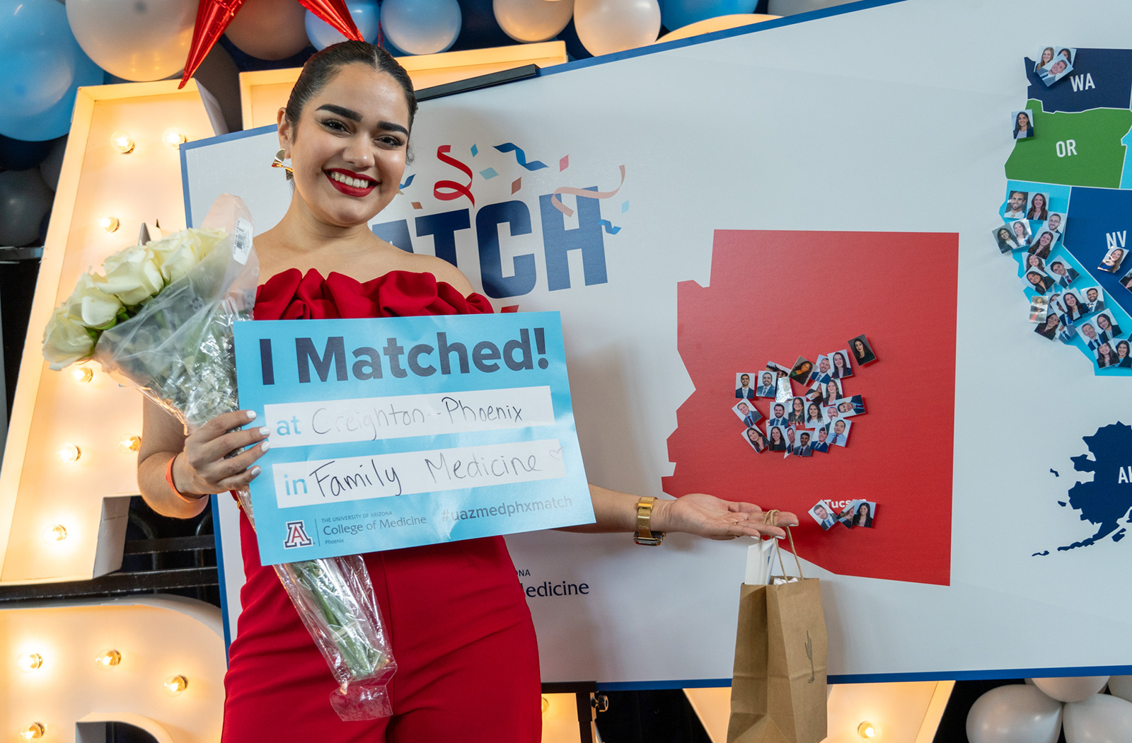 Jovanna Figueroa poses in front of the Match Day map
