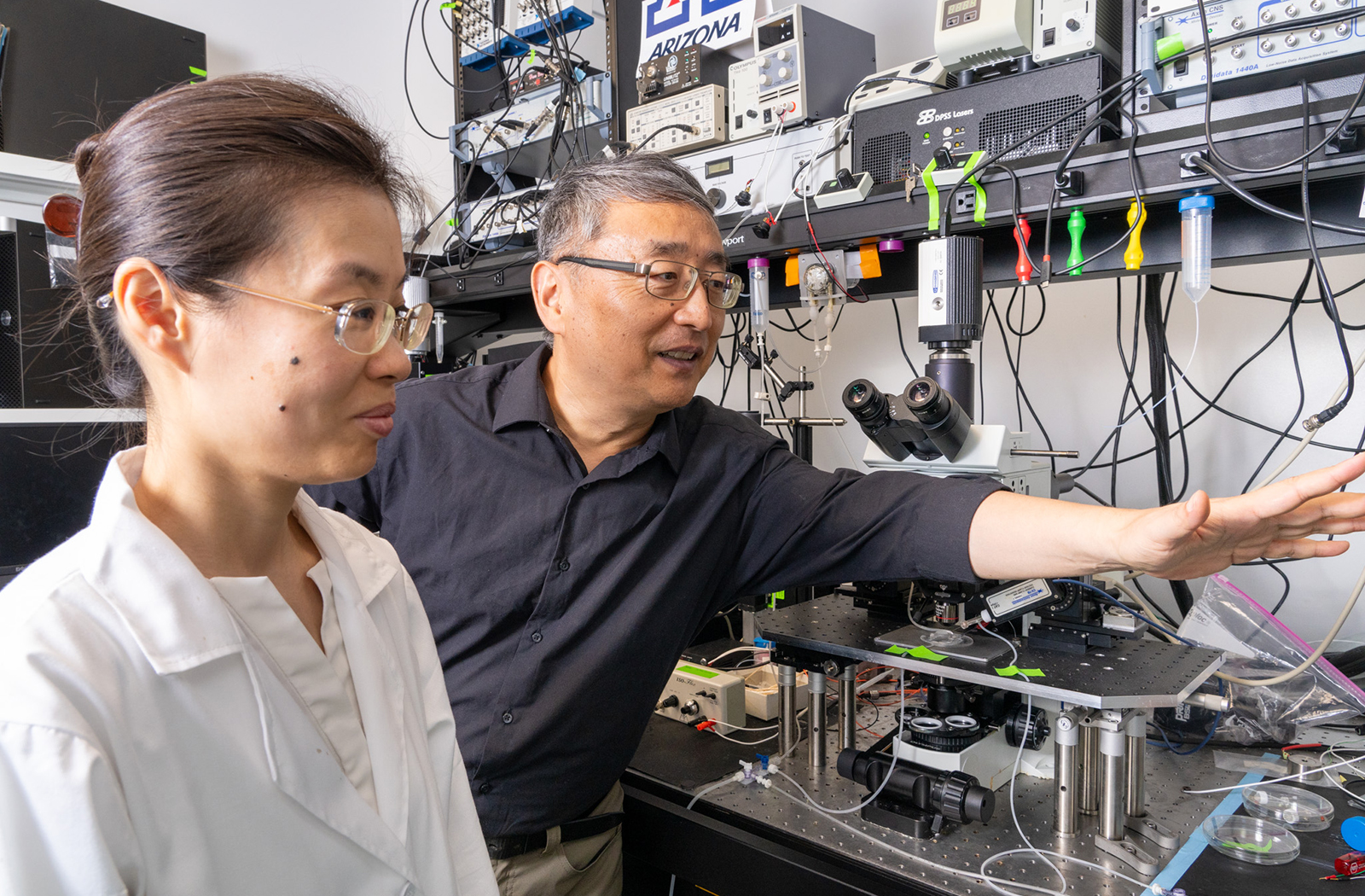 Shenfeng Qiu, PhD, and Jing Wei, a research scientist, in the lab