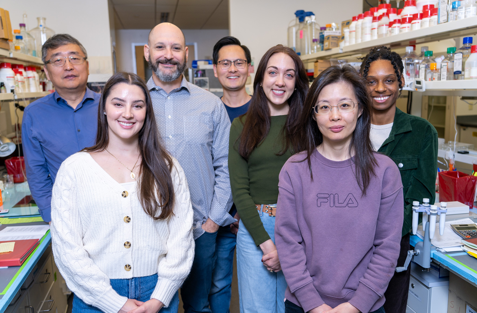 Drs. Qiu and Lifshitz (back left) with members of their respective research teams (from left to right) Brenda Lujan, MS, a CTS graduate student, Xiaokuang Ma, a postdoctoral researcher, Katherine R. Giordano, a postdoctoral researcher, Jing Wei, a research scientist, and Kyli A. McQueen, a post-baccalaureate student
