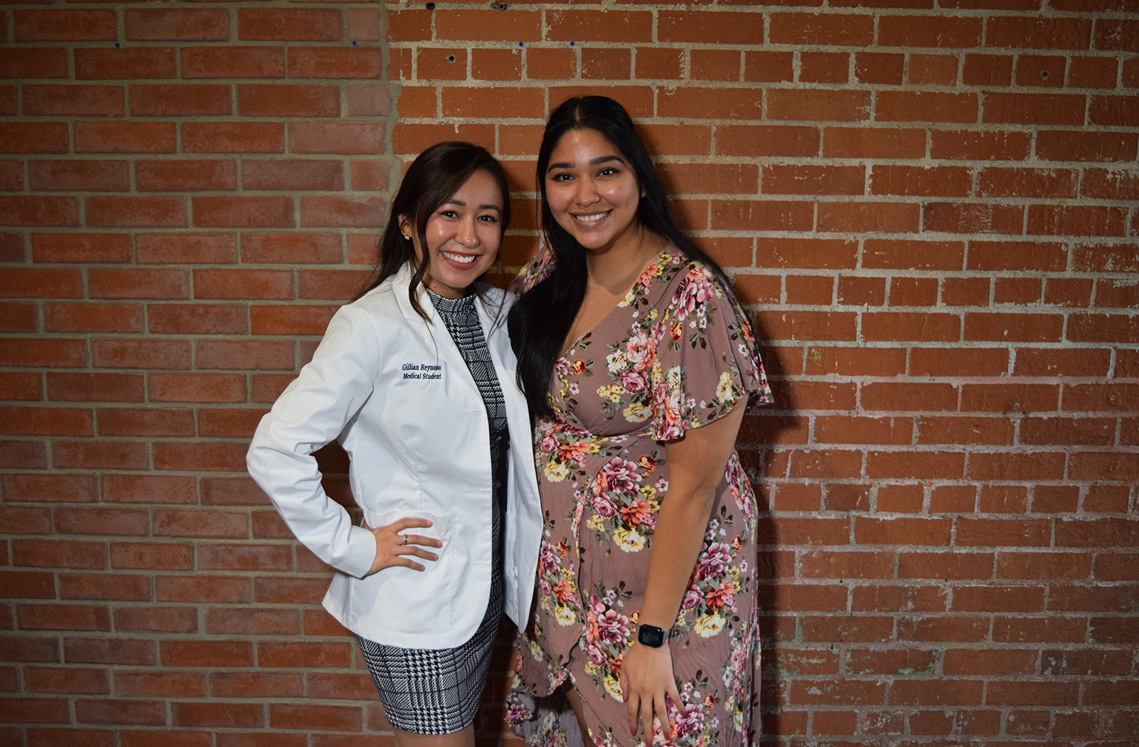 Gillian Reynoso at her White Coat Ceremony with her cousin Odaliz.