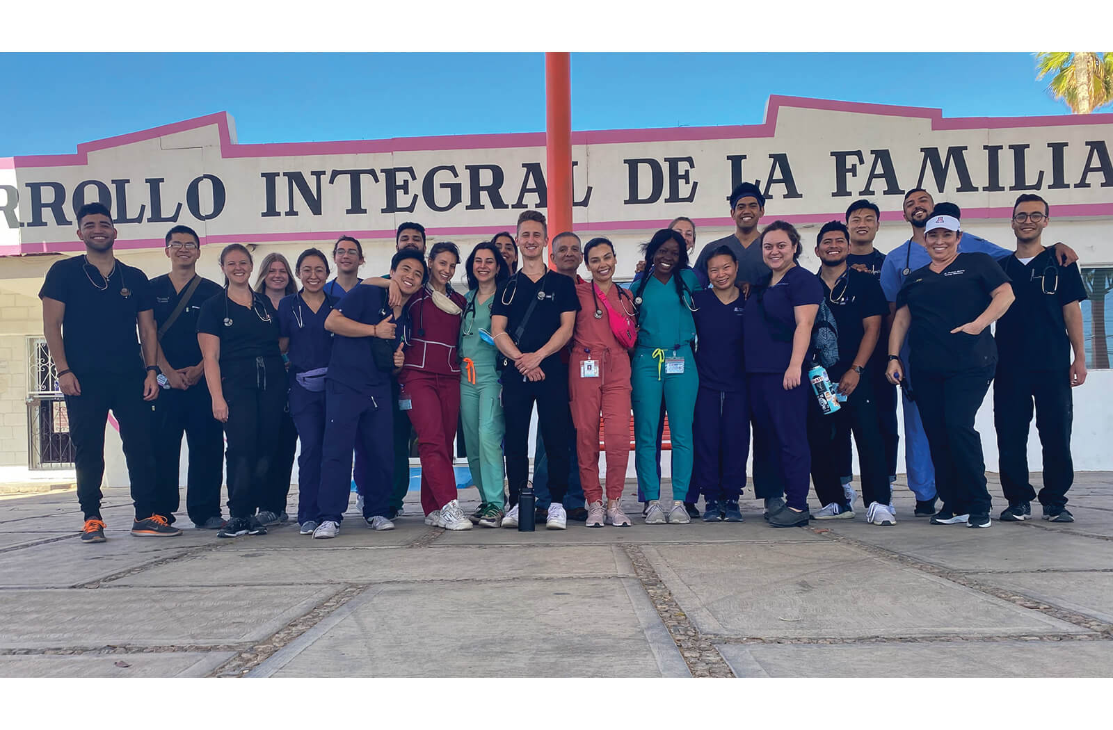 Students take a group photo outside of the Sonoyta clinic after their shift, prior to heading back to Phoenix