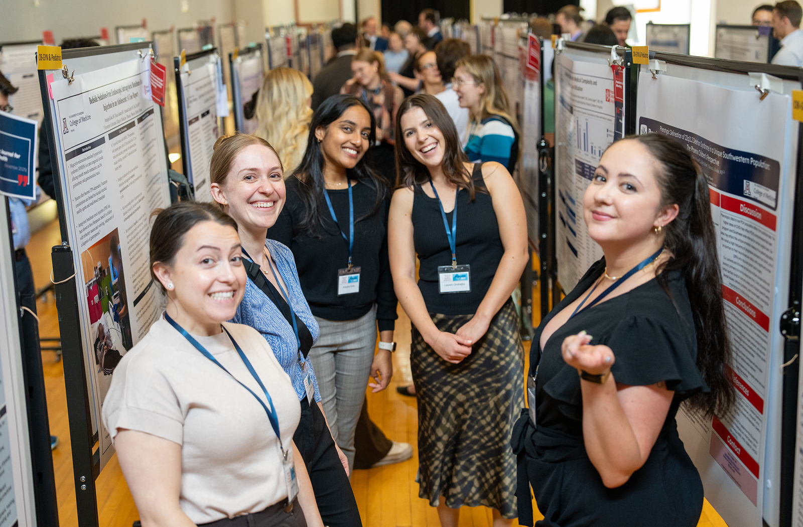 Class of 2026 medical students pose with their posters at the 16th Annual Scholarly Project Research Symposium.