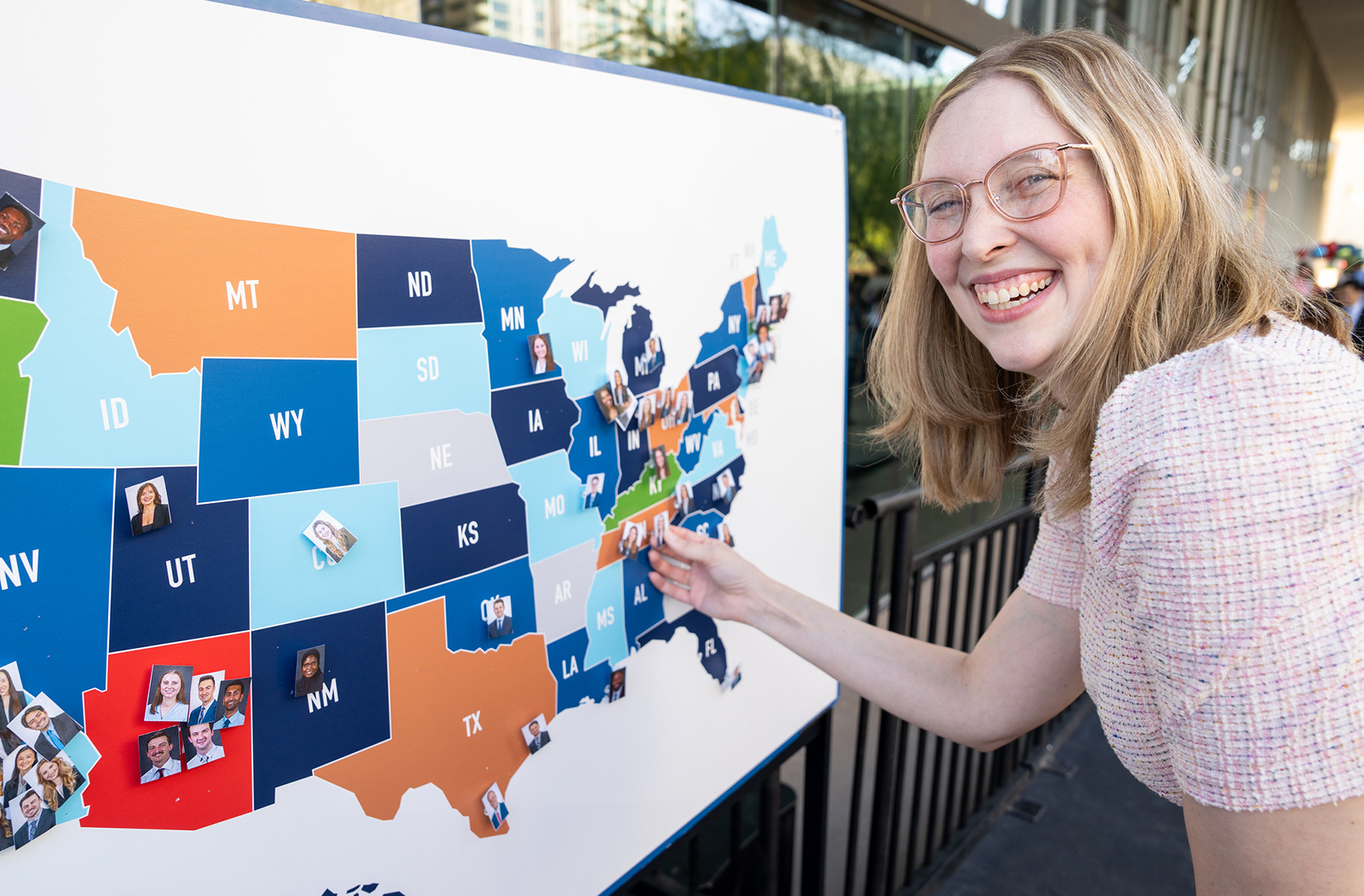 Emrie Tomaiko-Clark pins her match to the Match Day map during the event.