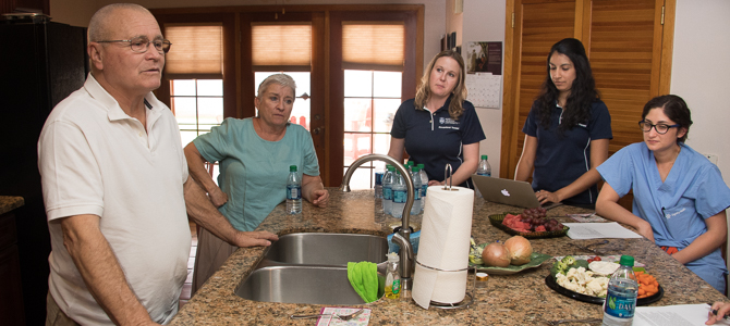 Students at Their Mentors Home in the Kitchen