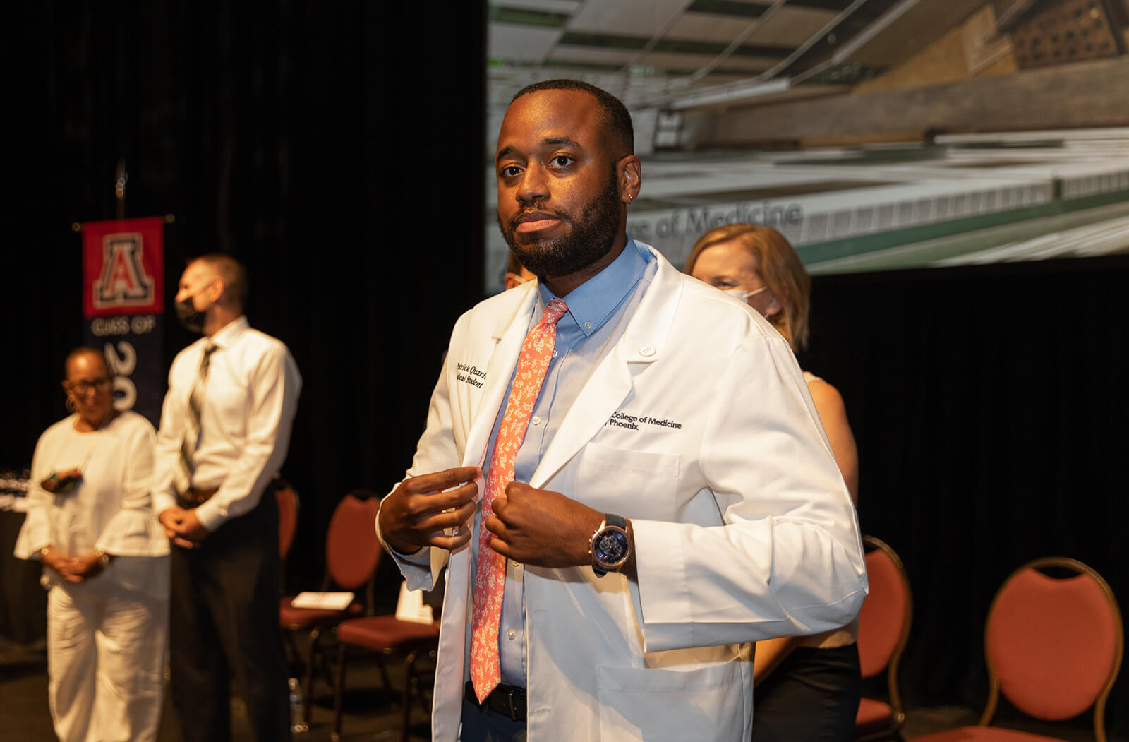First-year medical student Patrick Quarles receives his white coat during the Class of 2026 White Coat Ceremony