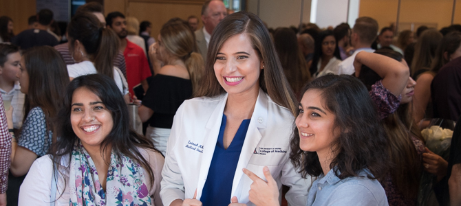 A Medical Student Poses with Her Family at the White Coat Ceremony