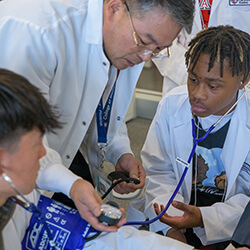 The students taking each other's blood pressure