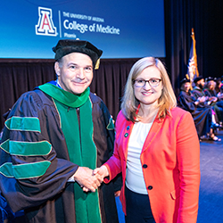 After her remarks, Dean Wondisford poses for a picture with Mayor Kate Gallego.