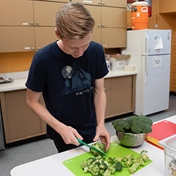 Student chops vegetables