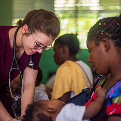 Merrion Dawson Works with a Patient During a Global Health Trip to the Dominican Republic
