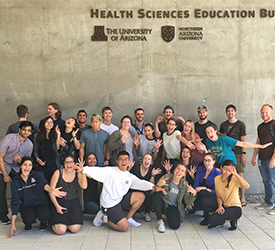Doan with His Fellow Medical Students Outside the Health Sciences Education Building