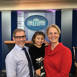 Dr. Dorsey and family in White House Press Briefing Room 