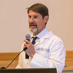 Robert Raschke, MD, presented a moving speech during the ceremony