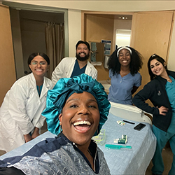 Dr. Bruno and other residents take a selfie with the Inclusive Hair, Inclusive Care kits.