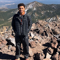 Brandon Klor on top of Mt. Humphreys in Flagstaff, Ariz.