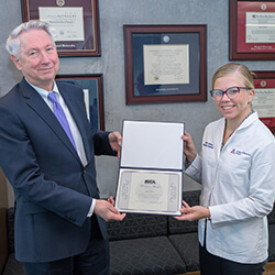 Kylie Kilian, with Dean Reed, received a MICA Medical Foundation Scholastic Award