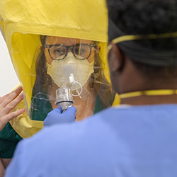 students learning how to wear PPE during the Coronavirus Pandemic