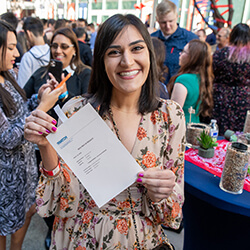 Jasmine Gill Poses with Her Match Letter