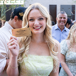 Lauren Hamilton proudly displays her Golden Ticket, showing she matched into pediatrics at Phoenix Children's.