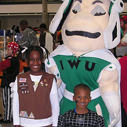 Raquel Moore with her younger brother during her years as a Girl Scout