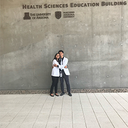 Tran and Nguyen Outside the Health Sciences Education Building