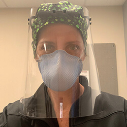 Dr. O'Hea in a Face Shield and Mask at the Hospital