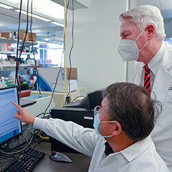 Dean Guy Reed working in his lab in the Biomedical Sciences Partnership Building