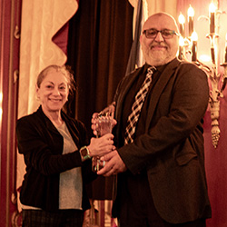 Dr. Rehman receiving the Karen M. Sanders, MD, Designated Education Officer (DEO) of the Year Award (Photo credit: William Jones)