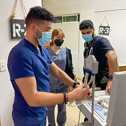 Kevin Salas shows other students how to prepare equipment for the clinic