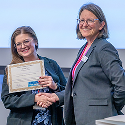 Taben Hale, PhD, presenting the second place award to Ashton Jorgensen, PhD, for her oral presentation. Taben Hale, PhD, presenting the second place award to Ashton Jorgensen, PhD, for her oral presentation.