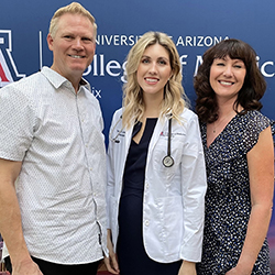 Schuurs' parents pose with her at the Class of 2025 White Coat Ceremony