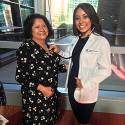 Solorio with her grandma at the Class of 2023 White Coat Ceremony