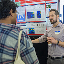 Kyle Roe Presents His Research at the Symposium