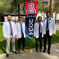 Surendra and fellow medical students with the Class of 2024 Banner