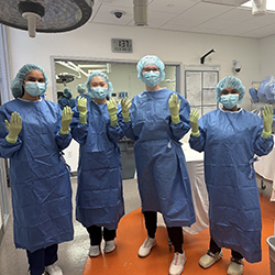 Tomaiko-Clark and fellow medical students get scrubbed in during a simulation exercise.