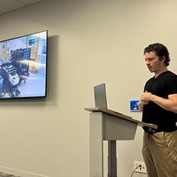 Dr. Tully presenting to a delegation from Germany. (photo courtesy of UCSD Center for Healthcare Cybersecurity)